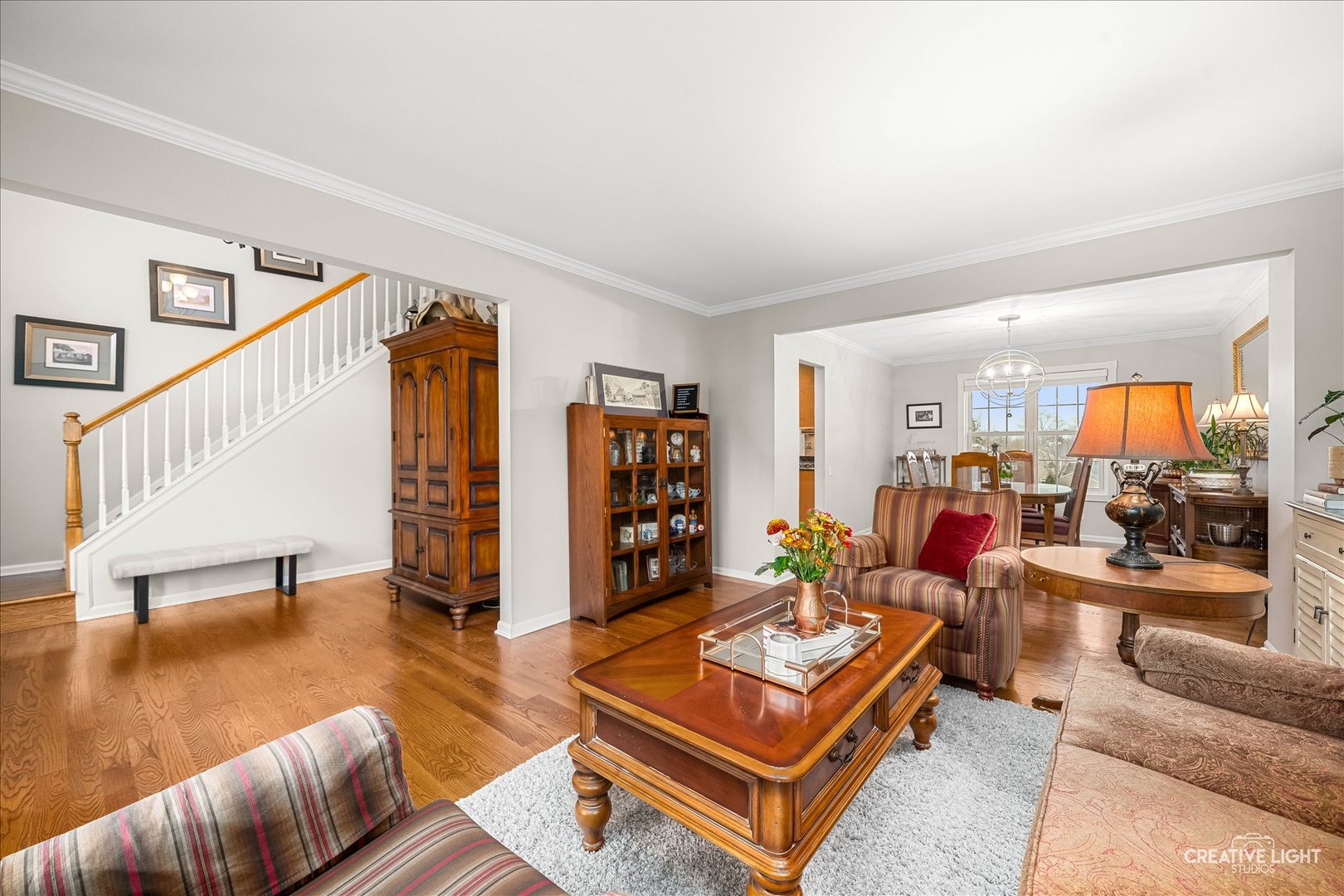 7 Falcon Ridge Court Algonquin, IL 60102 - Photo 6 of 51 a living room with furniture a wooden floor and next to a window