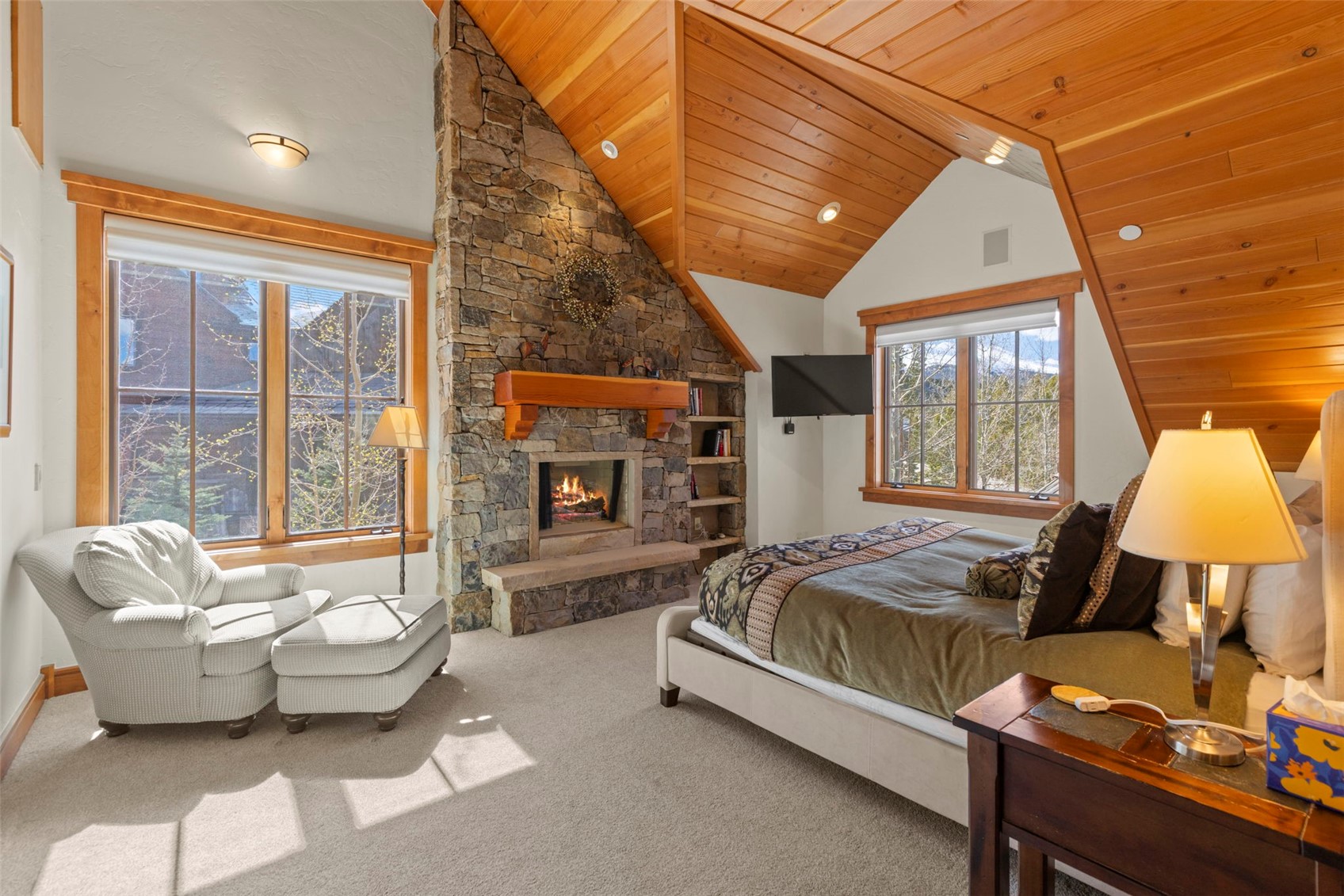 317 Timbertrail Road Breckenridge, CO 80424 - Photo 34 of 50 a spacious bedroom with a bed and wooden floor