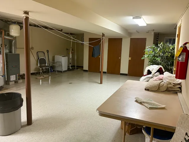 a living room with furniture and a table