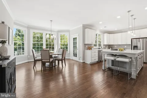 a dining room with furniture window wooden floor