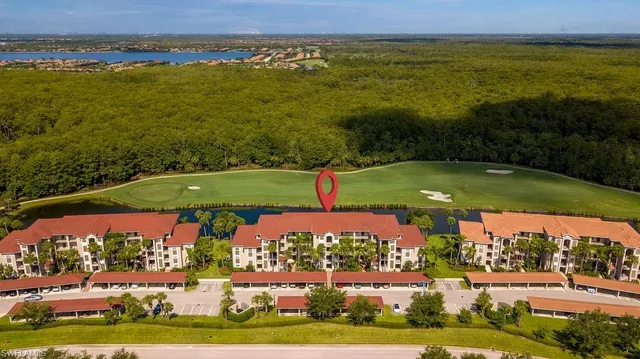 an aerial view of ocean with residential house and ocean view