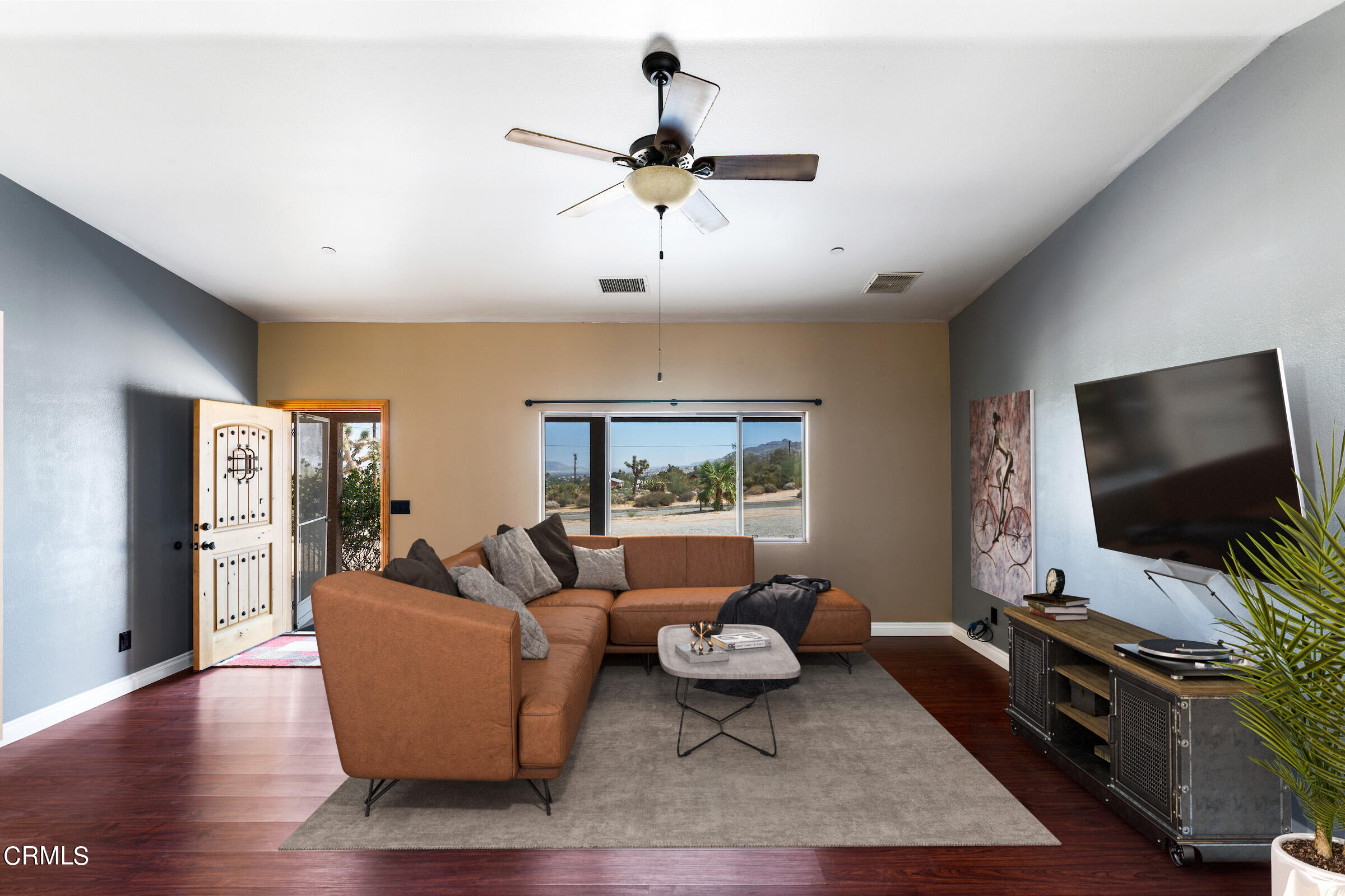 6864 Sunnyhill Road Joshua Tree, CA 92252 - Photo 22 of 71 a living room with furniture and a flat screen tv
