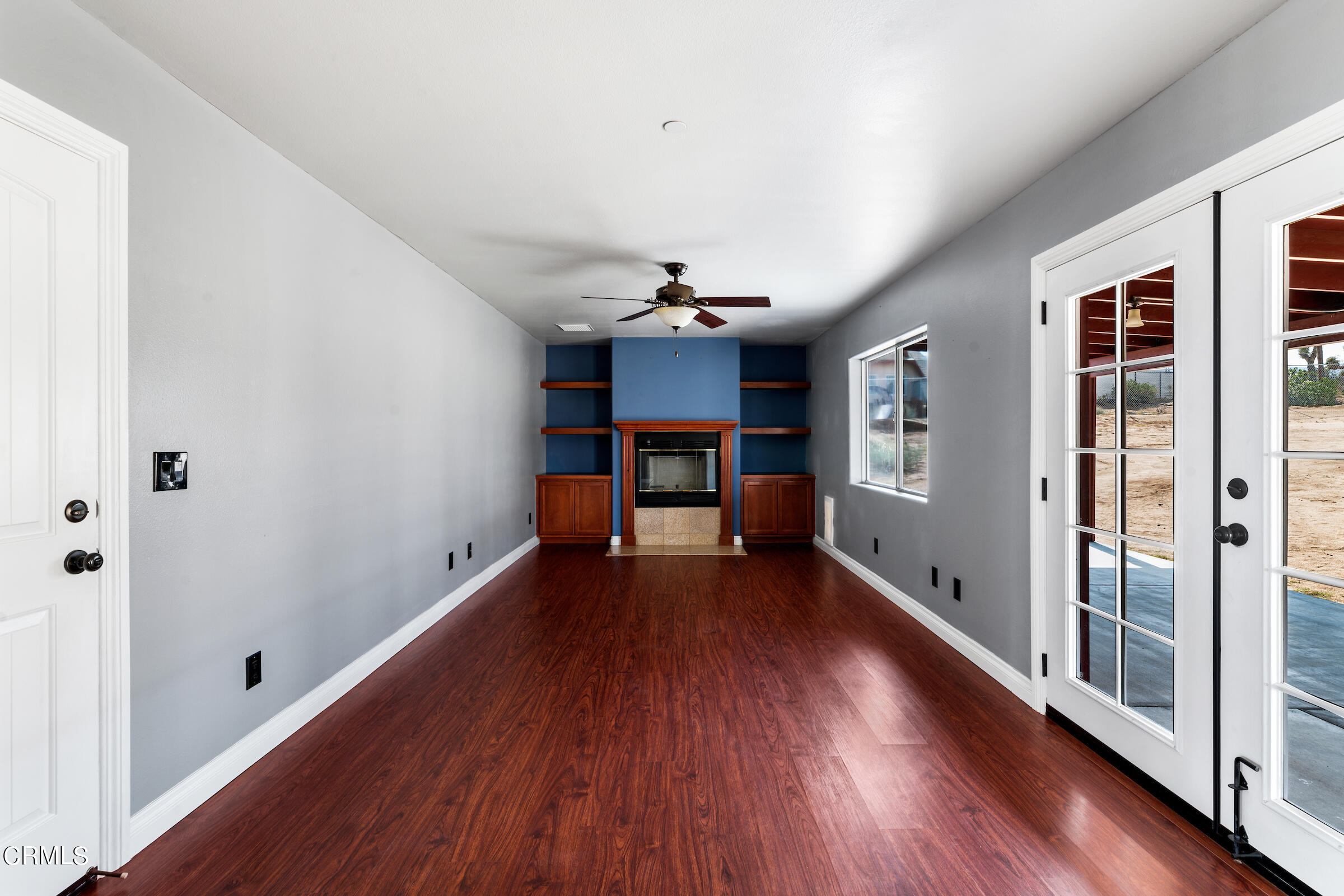 6864 Sunnyhill Road Joshua Tree, CA 92252 - Photo 29 of 71 a view of a room with wooden floor fireplace and window