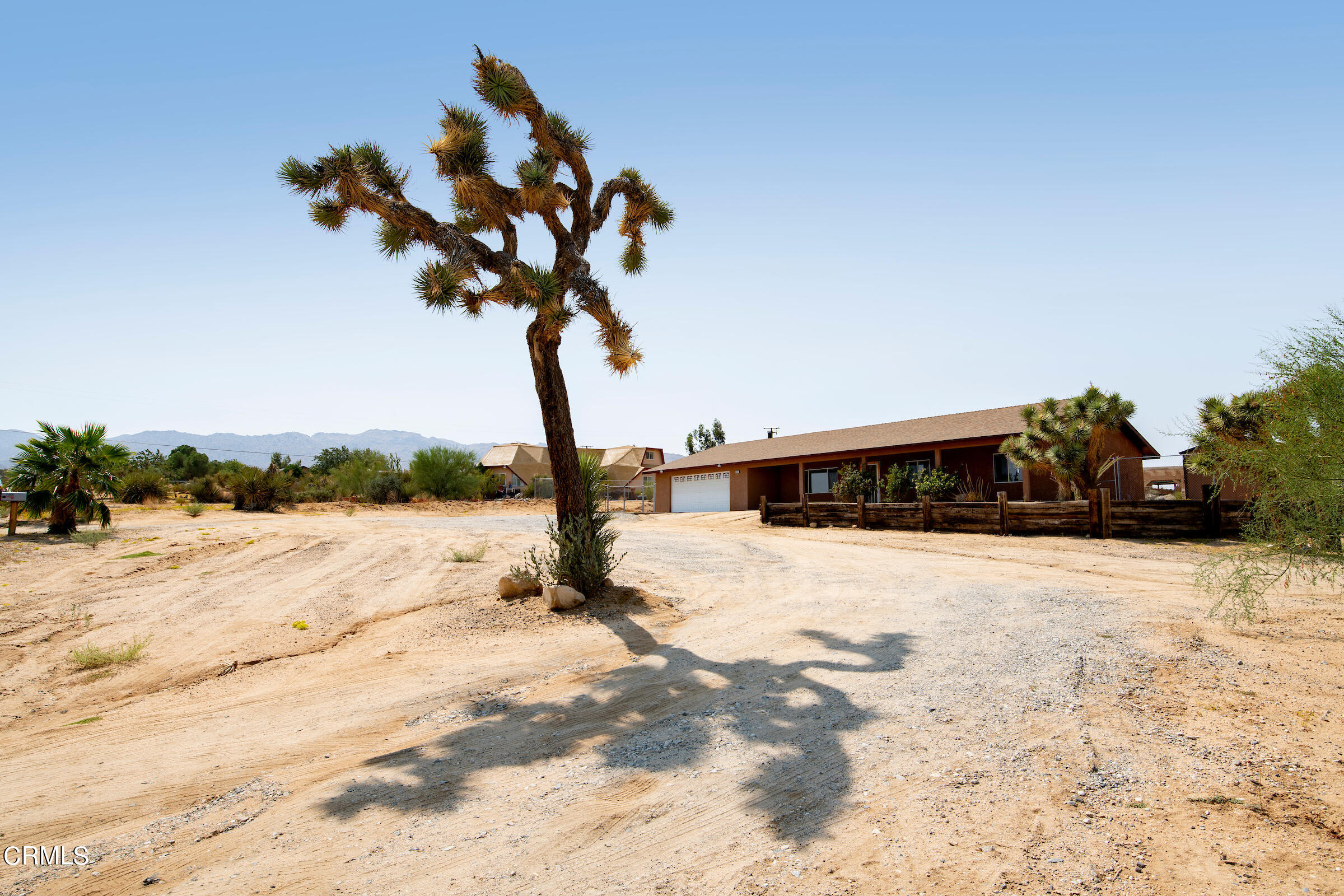 6864 Sunnyhill Road Joshua Tree, CA 92252 - Photo 4 of 71 a view of a house with snow on the road