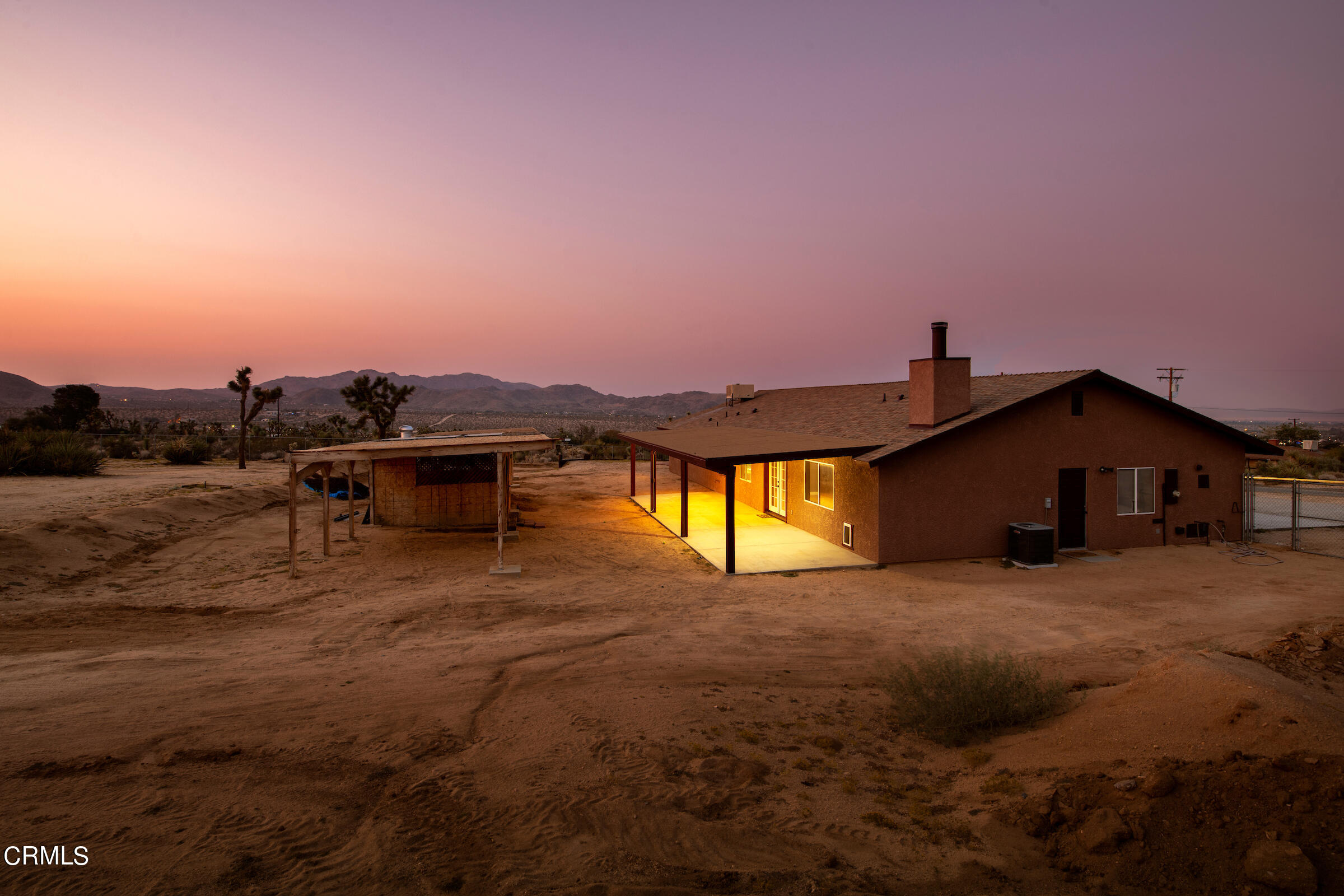 6864 Sunnyhill Road Joshua Tree, CA 92252 - Photo 64 of 71 a view of a house with a yard