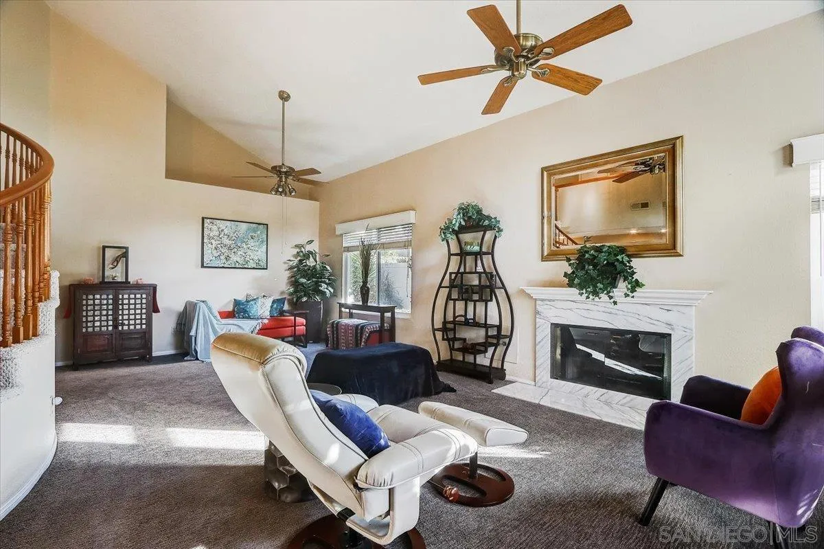 14381 Silver Heights Road Poway, CA 92064 - Photo 11 of 56 a living room with furniture a fireplace and a flat screen tv