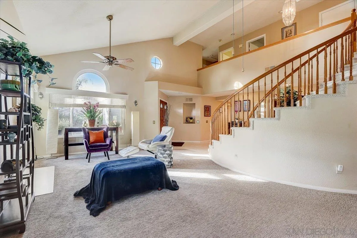14381 Silver Heights Road Poway, CA 92064 - Photo 13 of 56 a living room with furniture and a chandelier