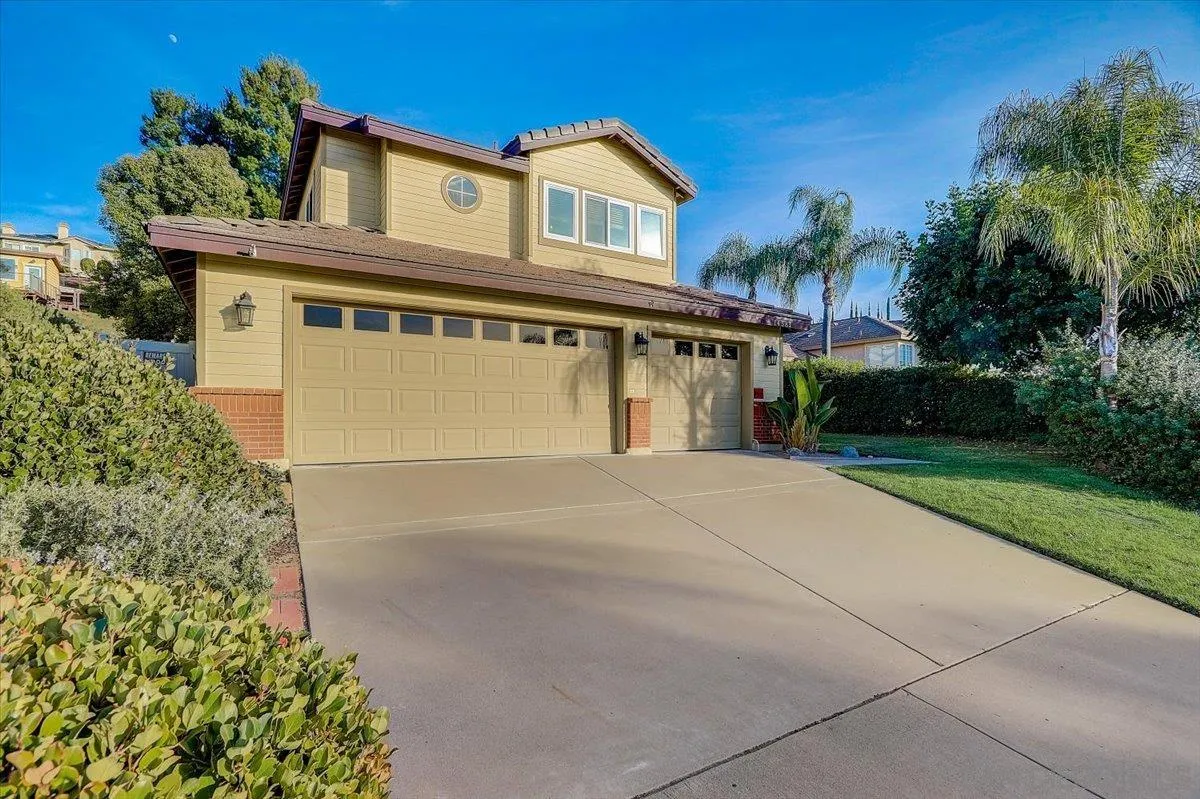 14381 Silver Heights Road Poway, CA 92064 - Photo 2 of 56 a front view of a house with a yard and a garage