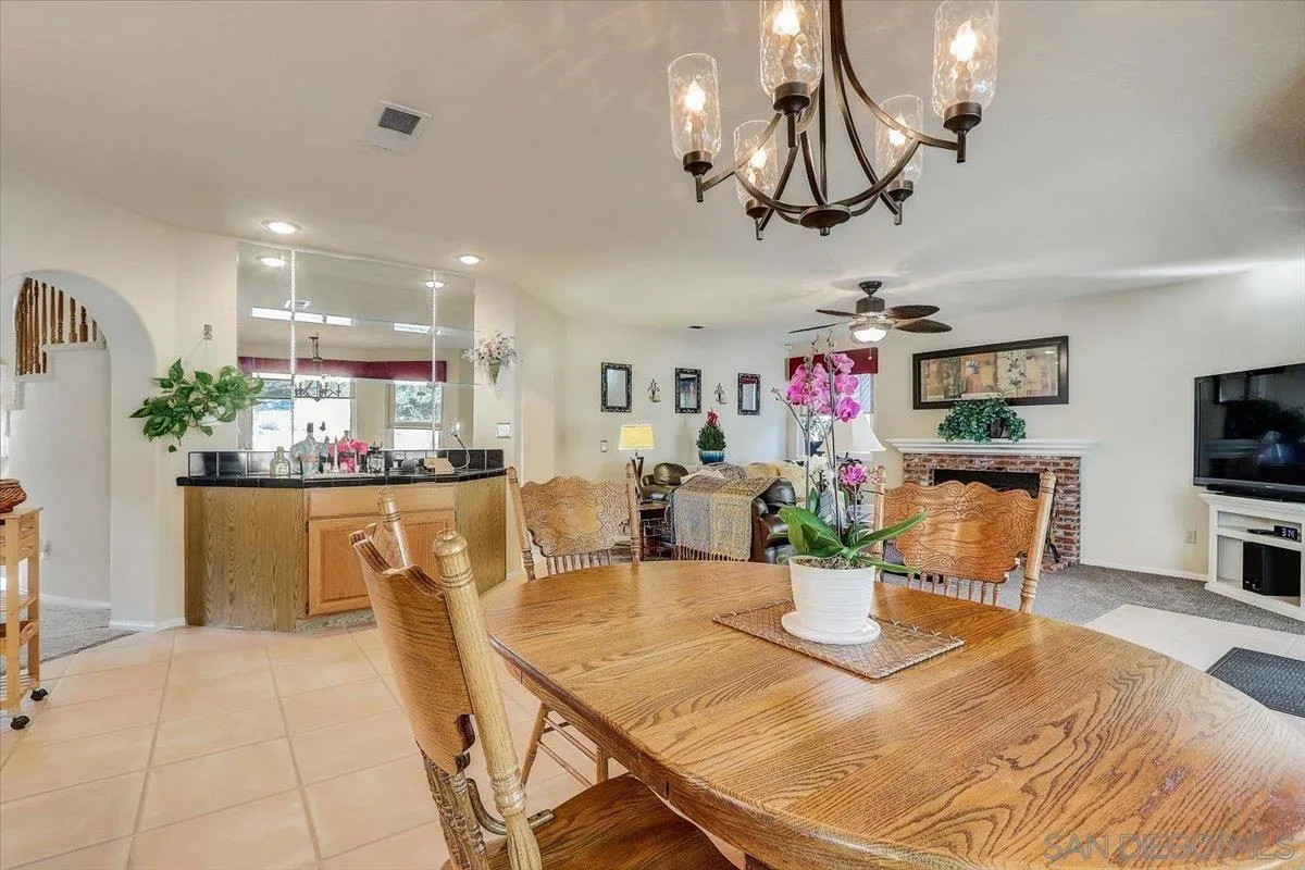 14381 Silver Heights Road Poway, CA 92064 - Photo 22 of 56 a view of a dining room with furniture