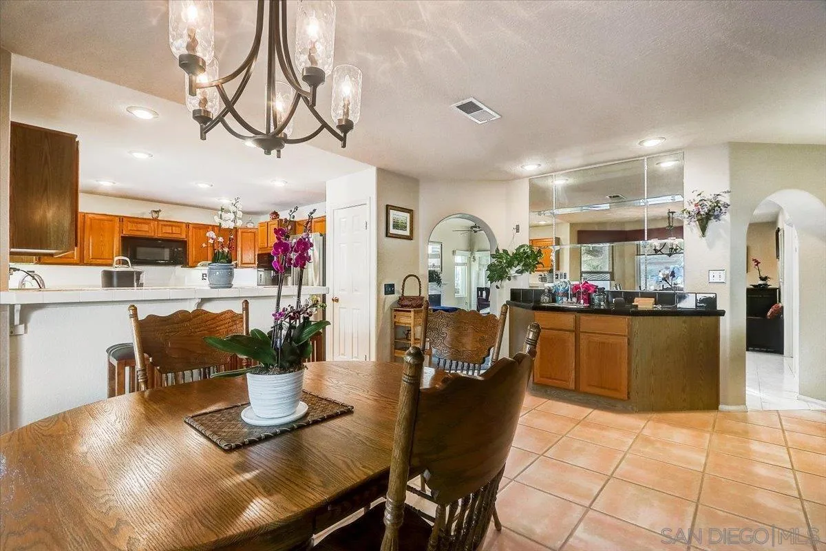 14381 Silver Heights Road Poway, CA 92064 - Photo 23 of 56 a dining room filled with lots of wooden furniture