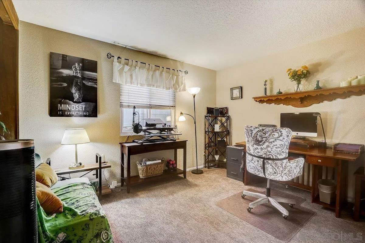 14381 Silver Heights Road Poway, CA 92064 - Photo 28 of 56 a living room with furniture rug and a window