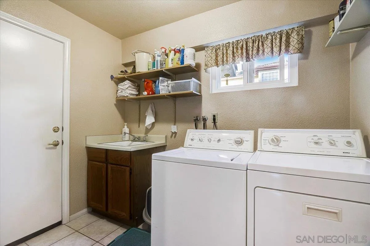 14381 Silver Heights Road Poway, CA 92064 - Photo 29 of 56 a utility room with dryer and washer
