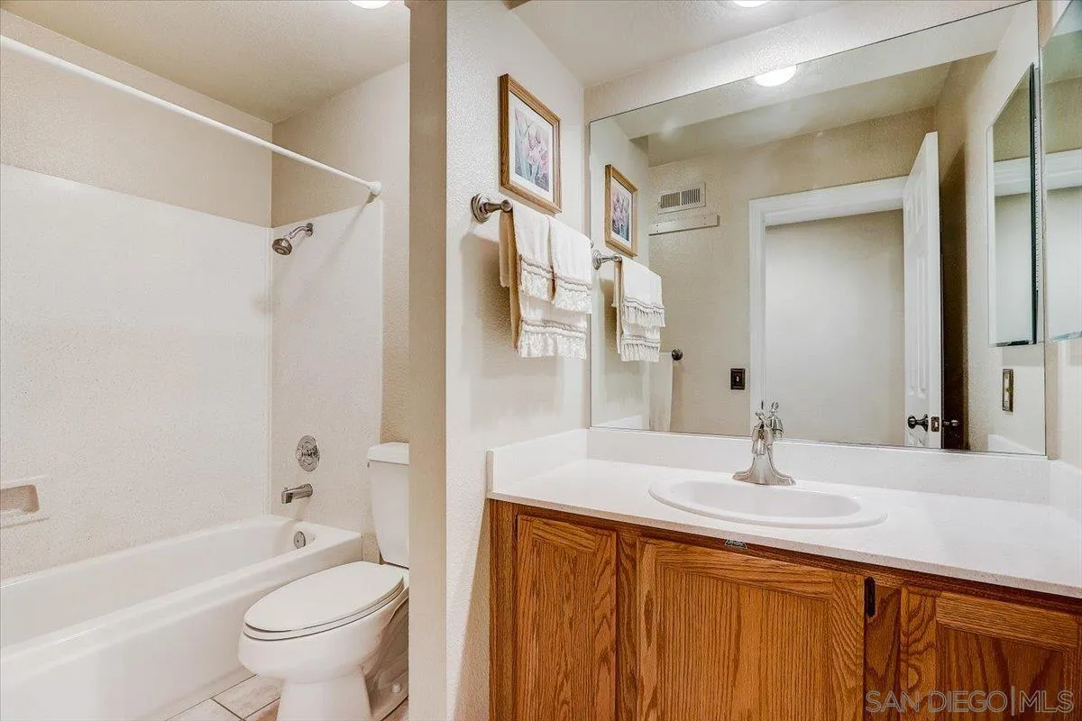 14381 Silver Heights Road Poway, CA 92064 - Photo 30 of 56 a bathroom with a sink a toilet and a bathtub