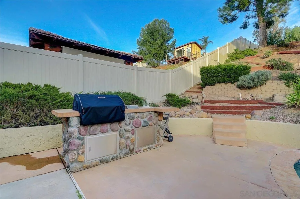 14381 Silver Heights Road Poway, CA 92064 - Photo 43 of 56 a view of a chairs and table in backyard