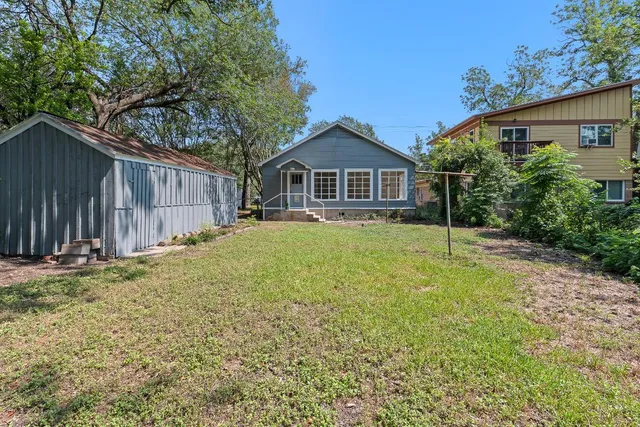a backyard of a house with lots of green space