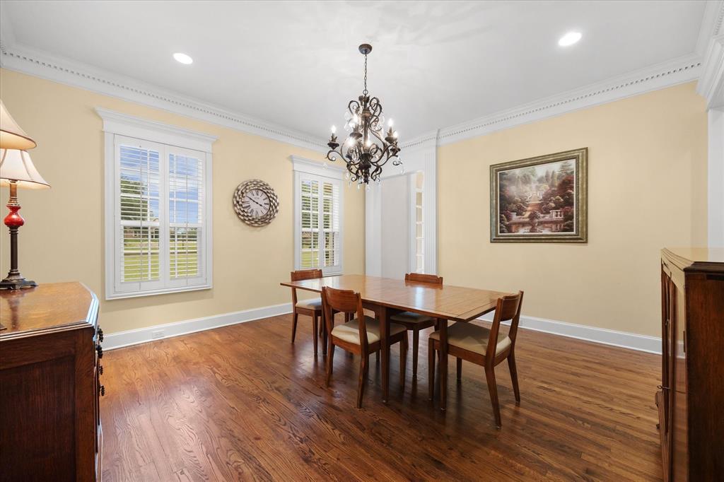 506 Meadowview Road Heath, TX 75032 - Photo 10 of 32 a view of a dining room with furniture window and wooden floor