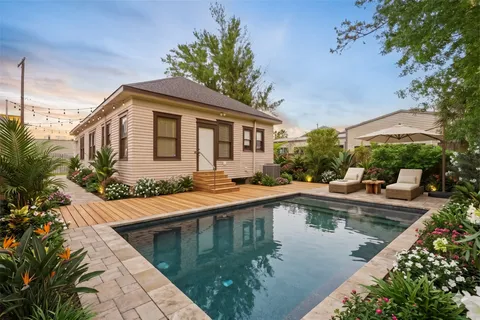 a house view with a swimming pool and outdoor space