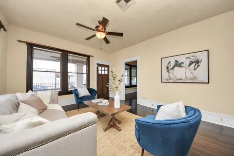 a living room with furniture and a window