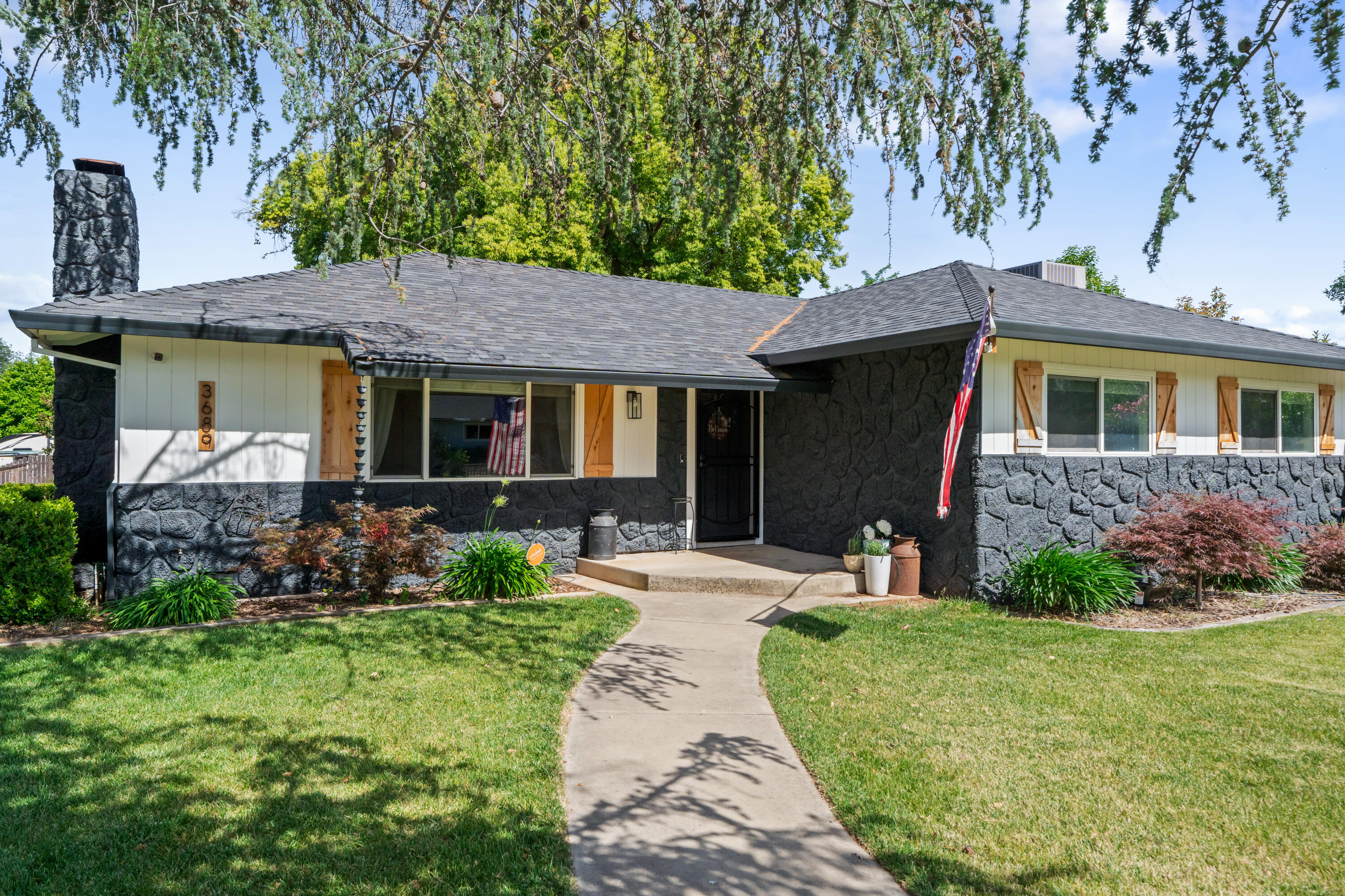 a front view of a house with garden
