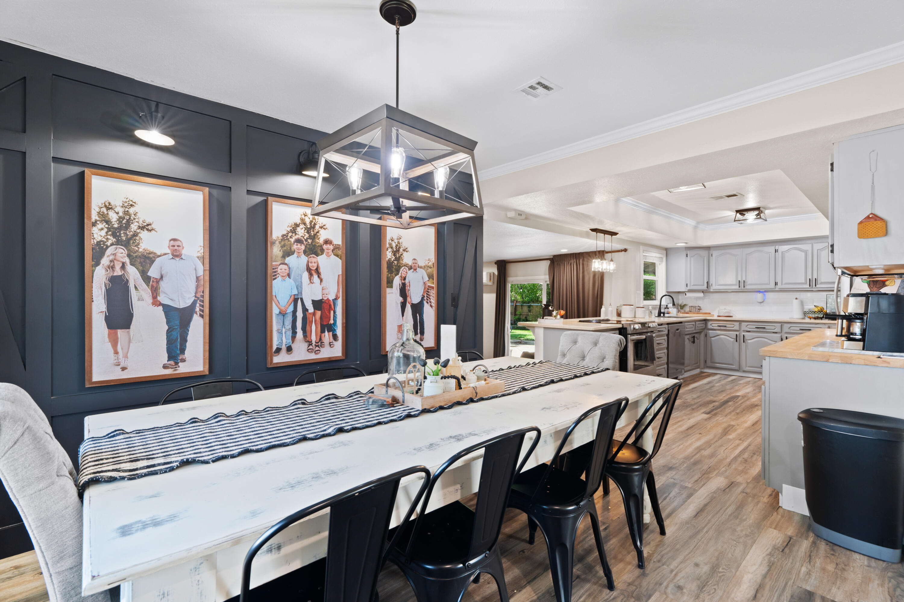3689 Suzanne Way Redding, CA 96002 - Photo 11 of 46 a view of a dining room with furniture wooden floor and chandelier