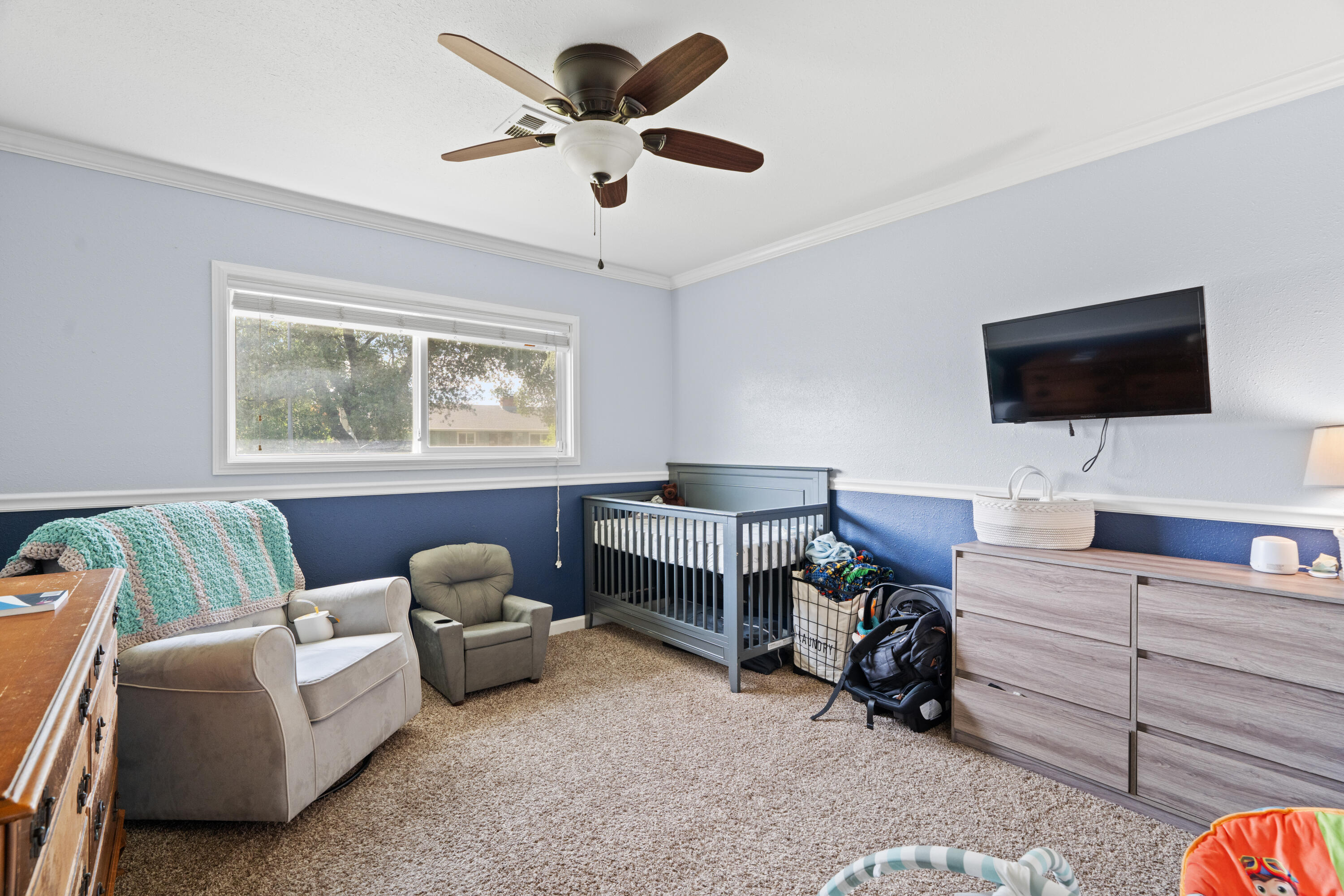 3689 Suzanne Way Redding, CA 96002 - Photo 26 of 46 a living room with furniture and a flat screen tv