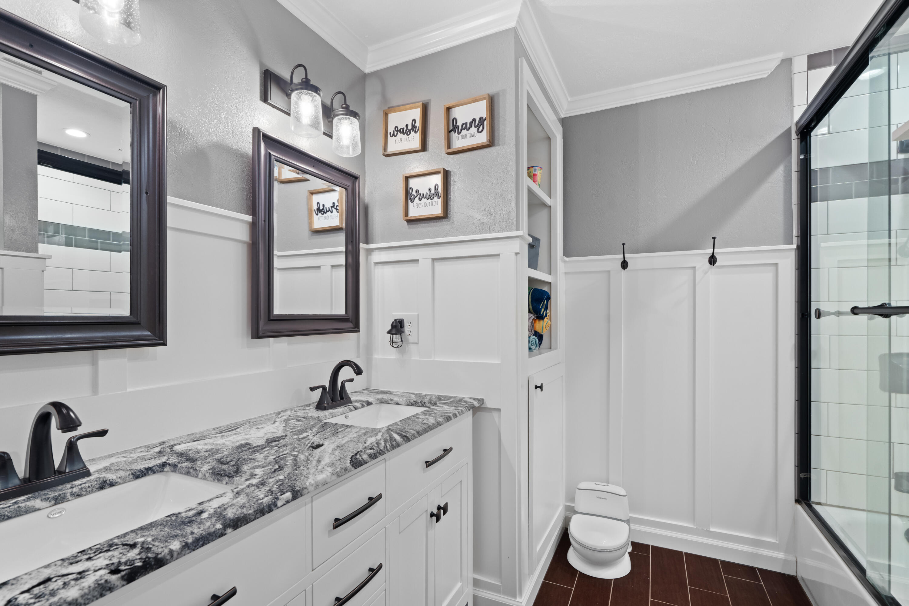 3689 Suzanne Way Redding, CA 96002 - Photo 32 of 46 a bathroom with double vanity sink and a mirror