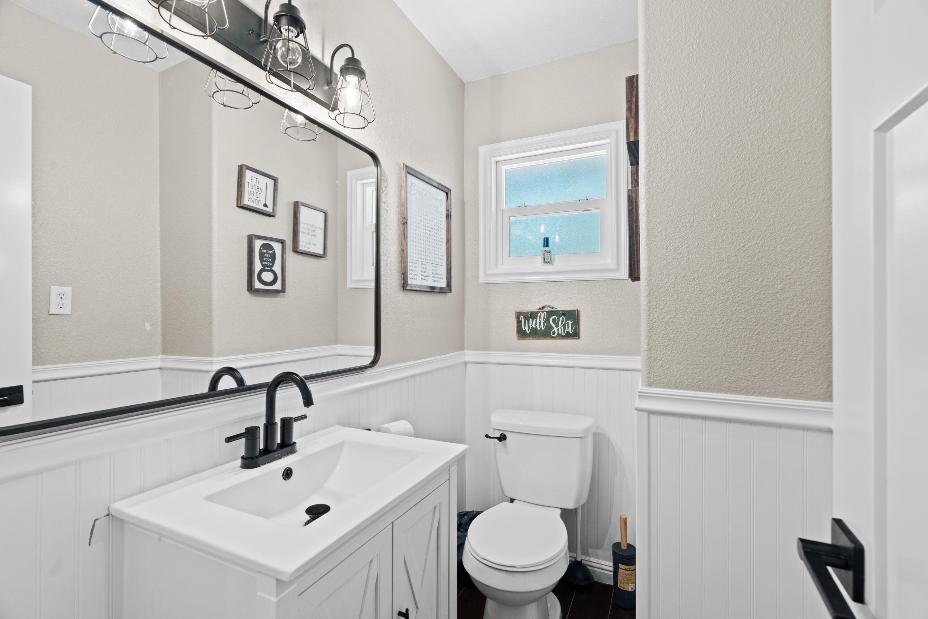 3689 Suzanne Way Redding, CA 96002 - Photo 34 of 46 a bathroom with a toilet sink and mirror