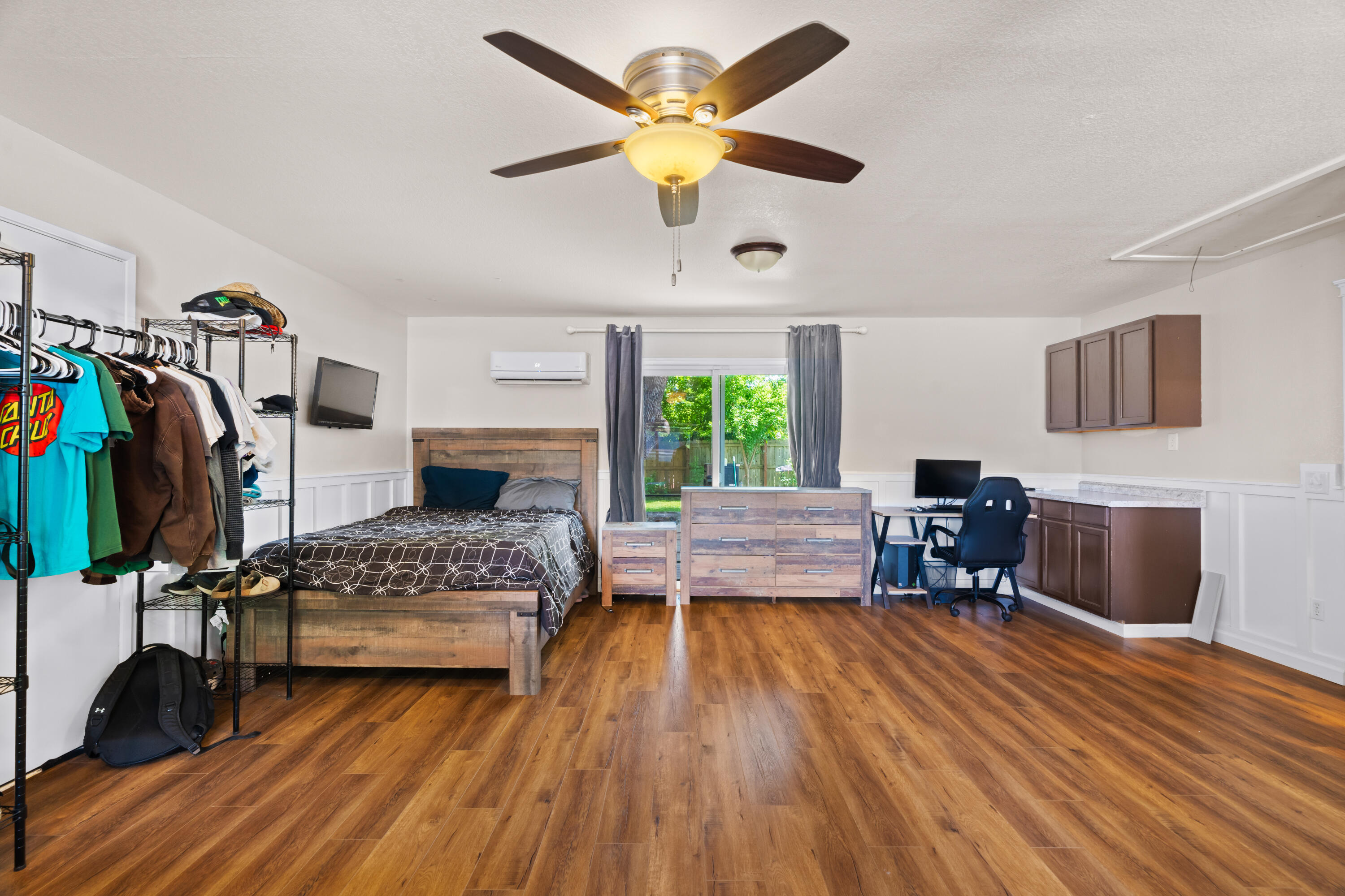 3689 Suzanne Way Redding, CA 96002 - Photo 37 of 46 a bedroom with a bed and a chandelier