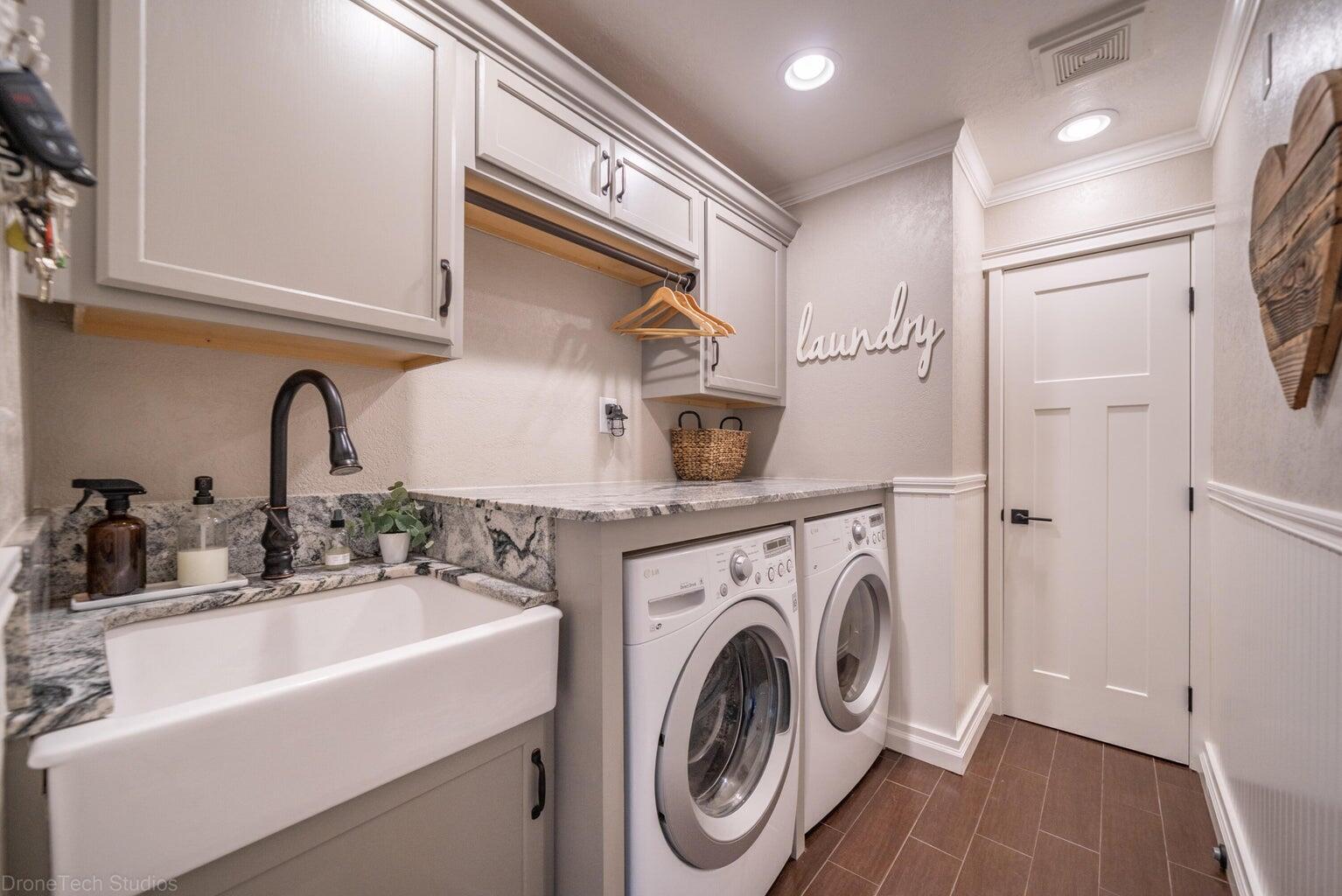 3689 Suzanne Way Redding, CA 96002 - Photo 39 of 46 a bathroom with a sink a washer and dryer