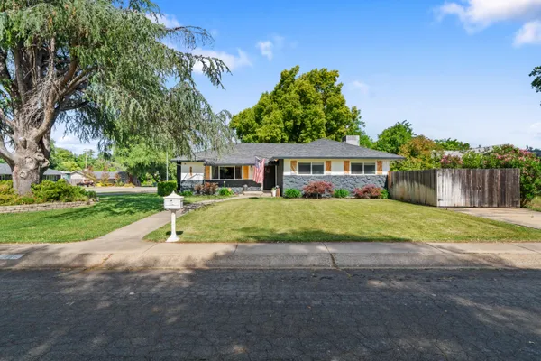 a view of house with outdoor space and street view