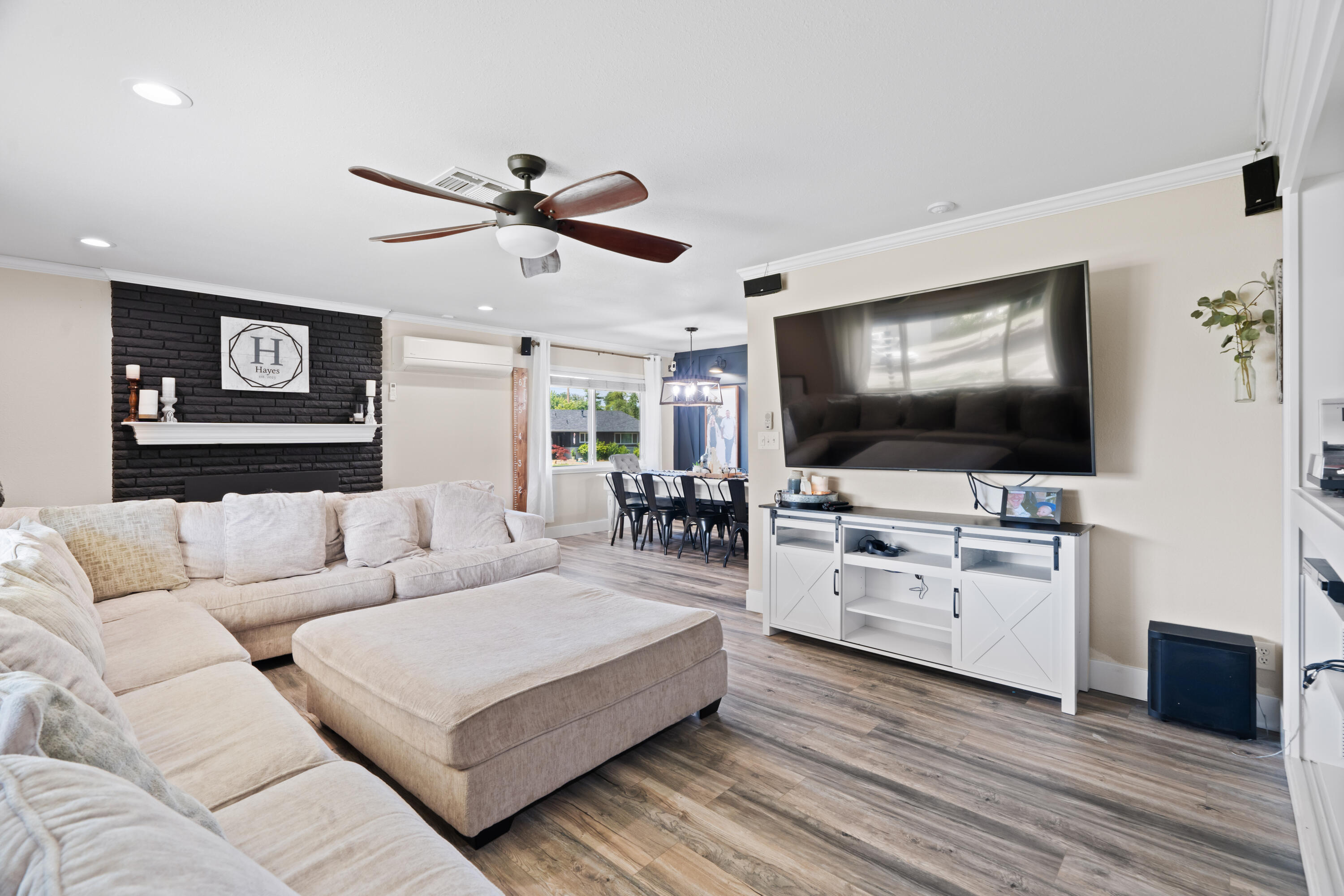 3689 Suzanne Way Redding, CA 96002 - Photo 6 of 46 a living room with furniture and a flat screen tv