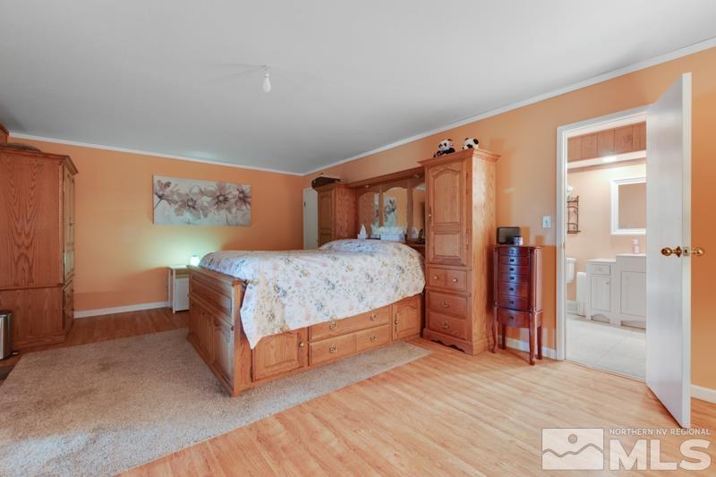 60 Rodeo Drive Reno, NV 89508 - Photo 11 of 37 a bedroom with a bed and a walk in closet