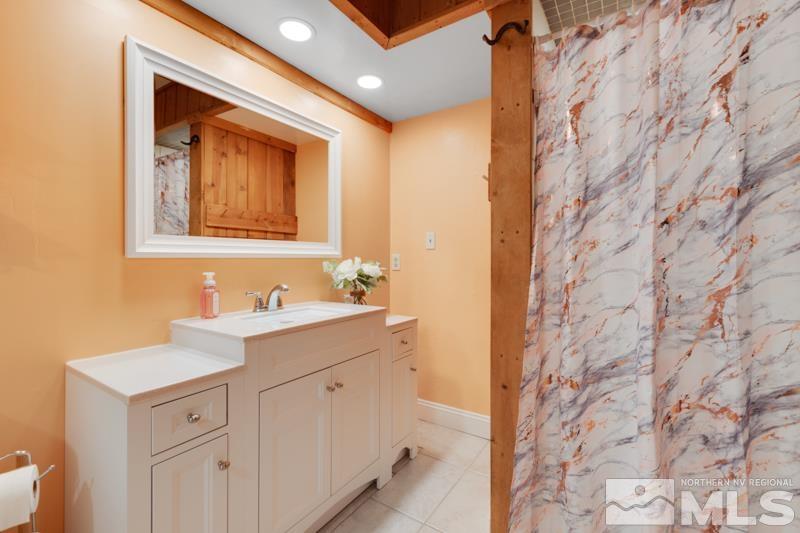 60 Rodeo Drive Reno, NV 89508 - Photo 13 of 37 a bathroom with a sink and a mirror
