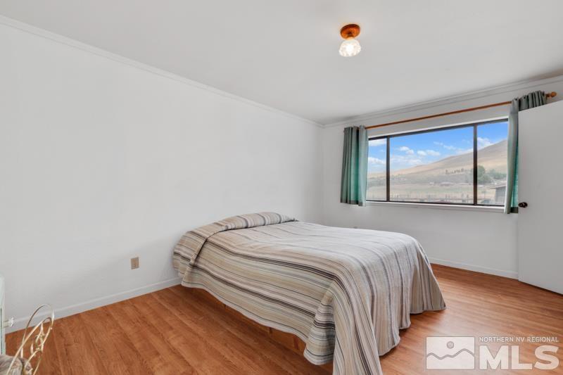 60 Rodeo Drive Reno, NV 89508 - Photo 15 of 37 a bedroom with a bed and a window