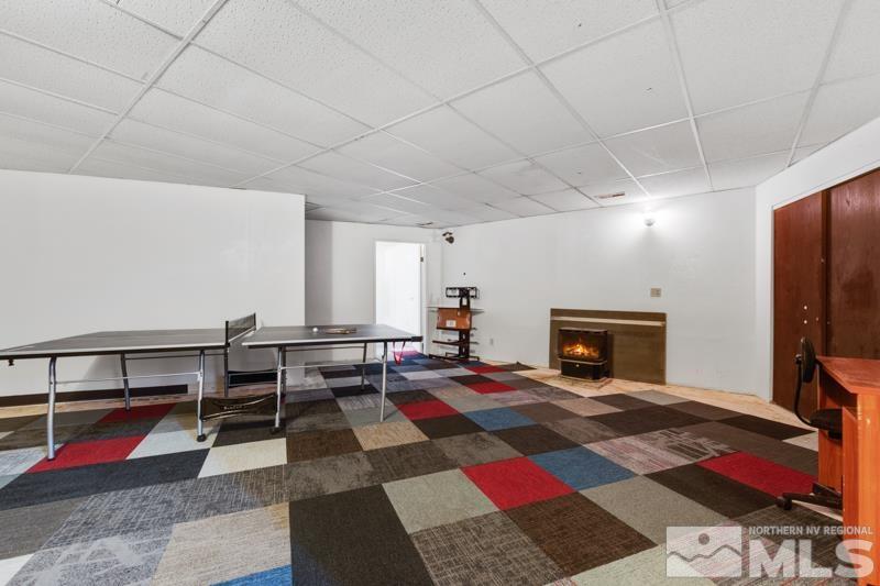 60 Rodeo Drive Reno, NV 89508 - Photo 18 of 37 a bedroom with furniture and a fireplace