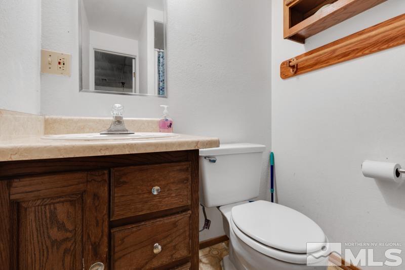 60 Rodeo Drive Reno, NV 89508 - Photo 21 of 37 a bathroom with a sink a toilet and mirror