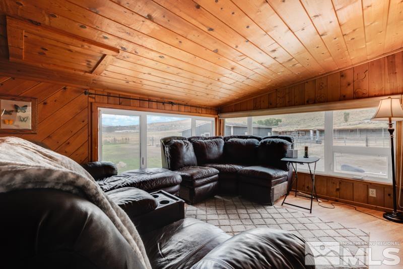 60 Rodeo Drive Reno, NV 89508 - Photo 4 of 37 a living room with furniture a flat screen tv and balcony view