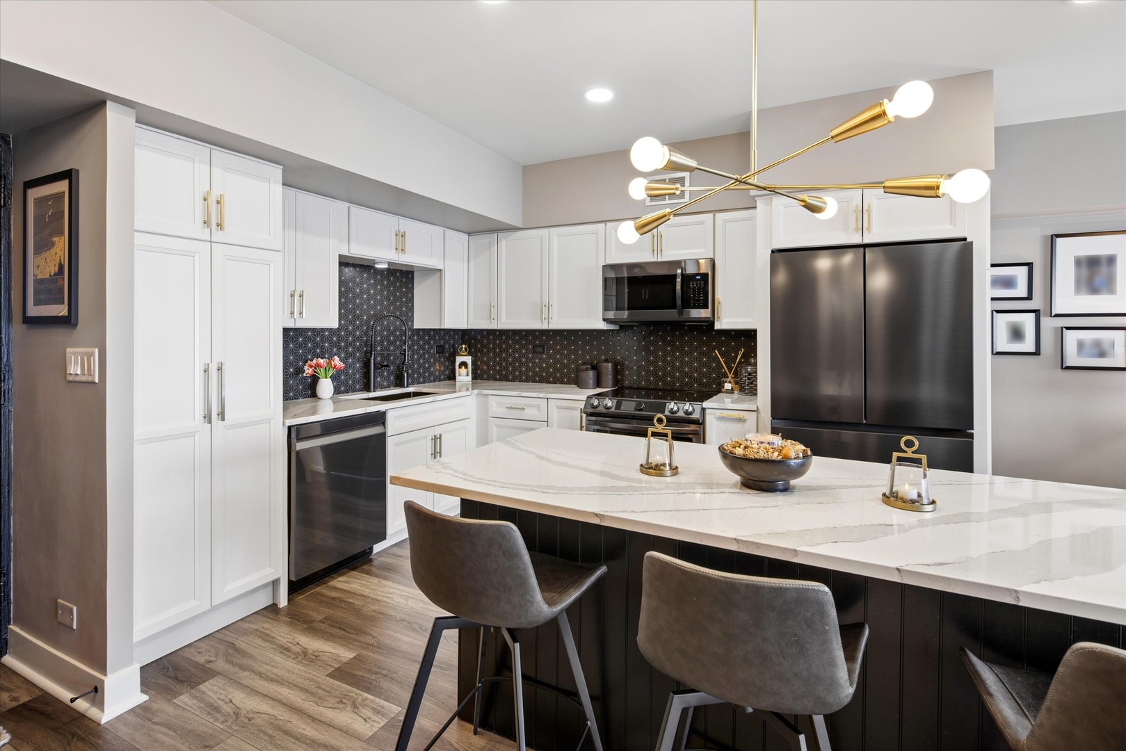 175 East Delaware Place, Unit 7304 Chicago, IL 60611 - Photo 11 of 36 a kitchen with stainless steel appliances a sink and a refrigerator