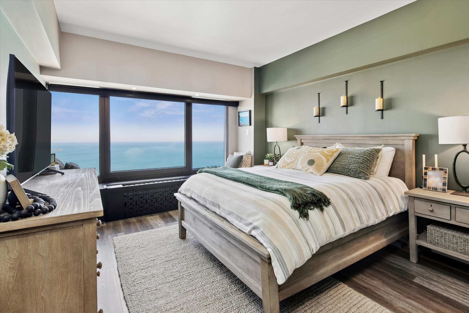 175 East Delaware Place, Unit 7304 Chicago, IL 60611 - Photo 15 of 36 a bedroom with a bed and a dresser next to a window