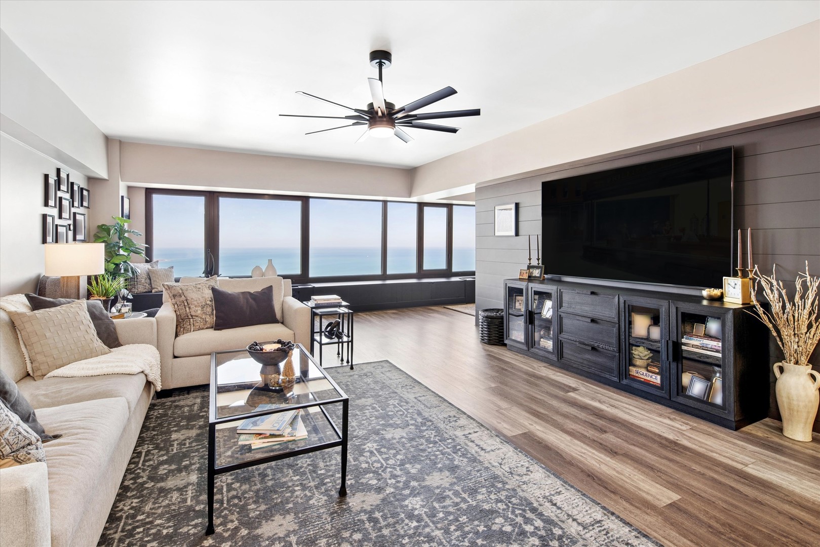 175 East Delaware Place, Unit 7304 Chicago, IL 60611 - Photo 2 of 36 a living room with furniture and a flat screen tv