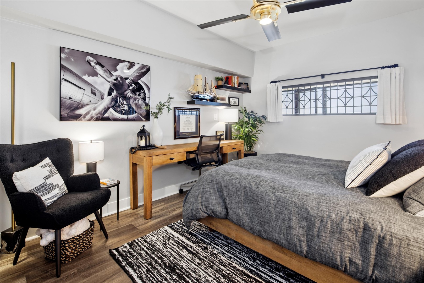 175 East Delaware Place, Unit 7304 Chicago, IL 60611 - Photo 21 of 36 a bedroom with a bed and wooden floor