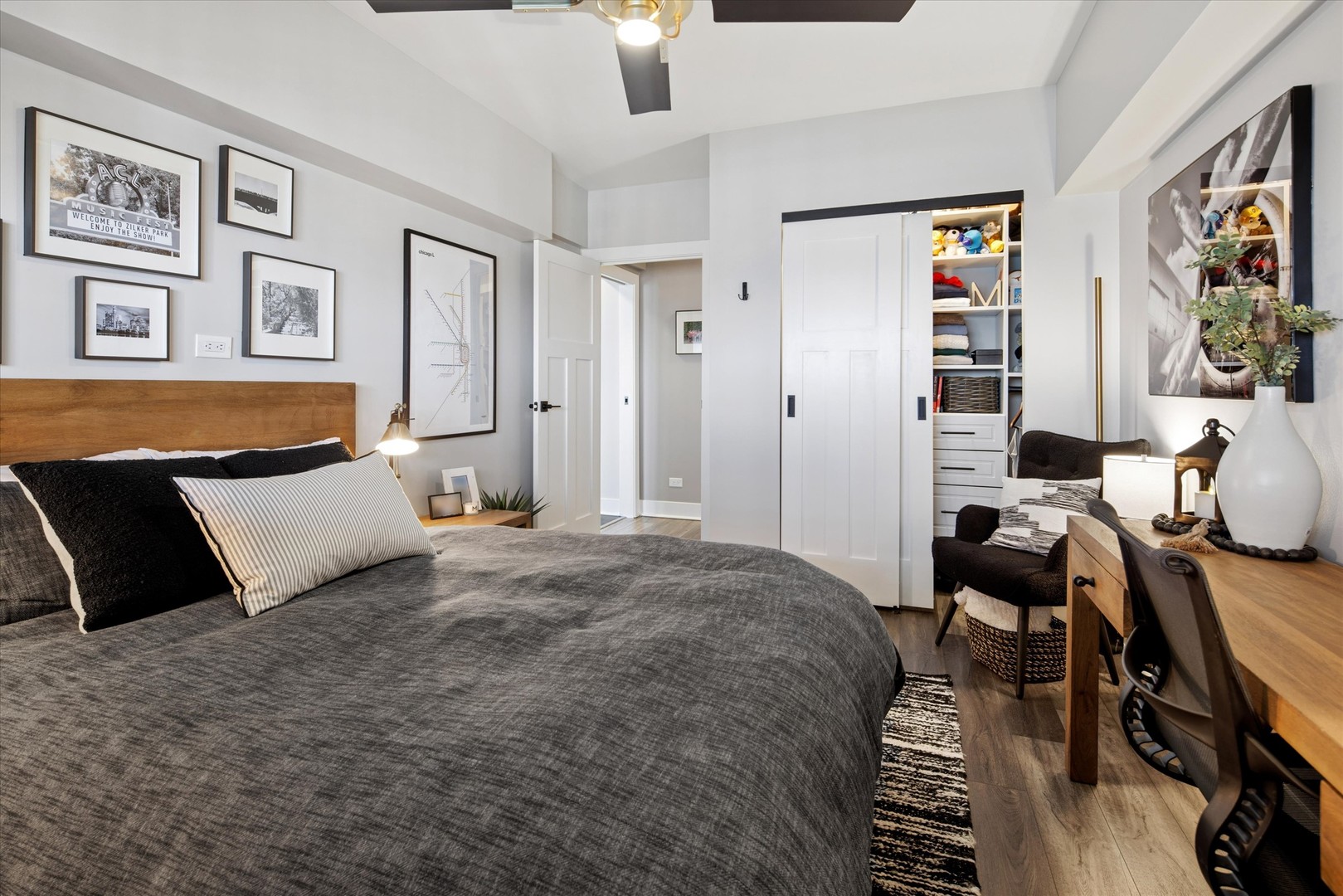 175 East Delaware Place, Unit 7304 Chicago, IL 60611 - Photo 22 of 36 a bedroom with a bed and wooden floor