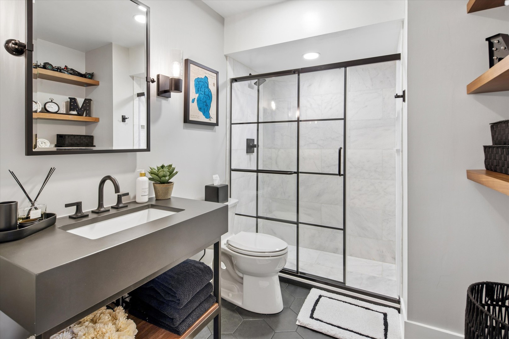 175 East Delaware Place, Unit 7304 Chicago, IL 60611 - Photo 23 of 36 a bathroom with a sink toilet and shower