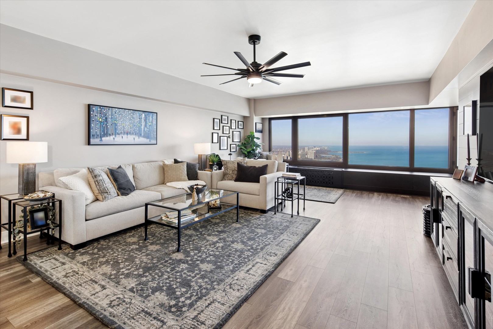 175 East Delaware Place, Unit 7304 Chicago, IL 60611 - Photo 3 of 36 a living room with furniture and a rug