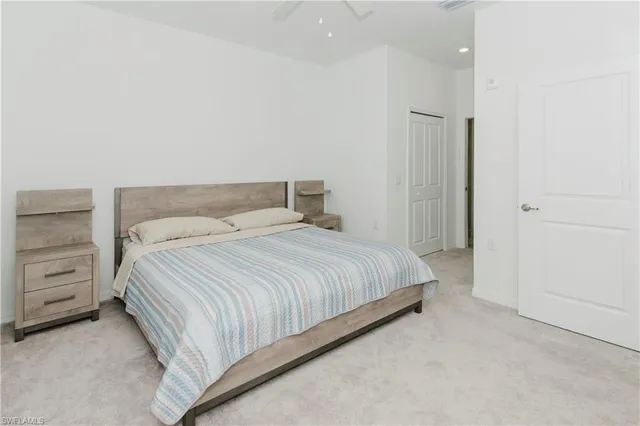 a bedroom with a bed and furniture