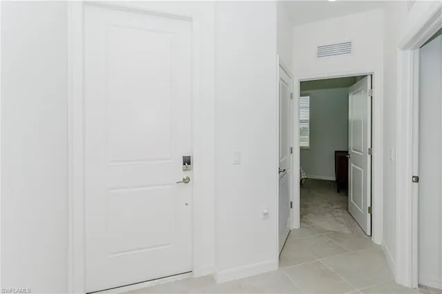 a view of a hallway with a white walls