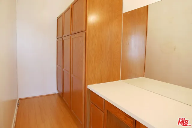 a bathroom with a shower and a glass door
