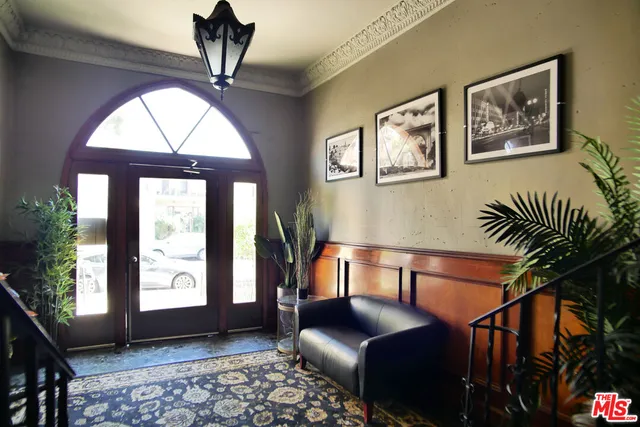 a bedroom with furniture and a window