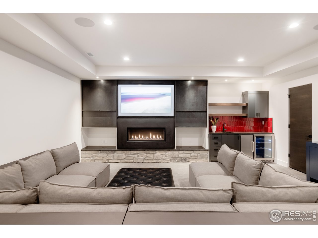 3996 26th Street Boulder, CO 80304 - Photo 31 of 39 Lower Level Family Room / Media Room with fireplace