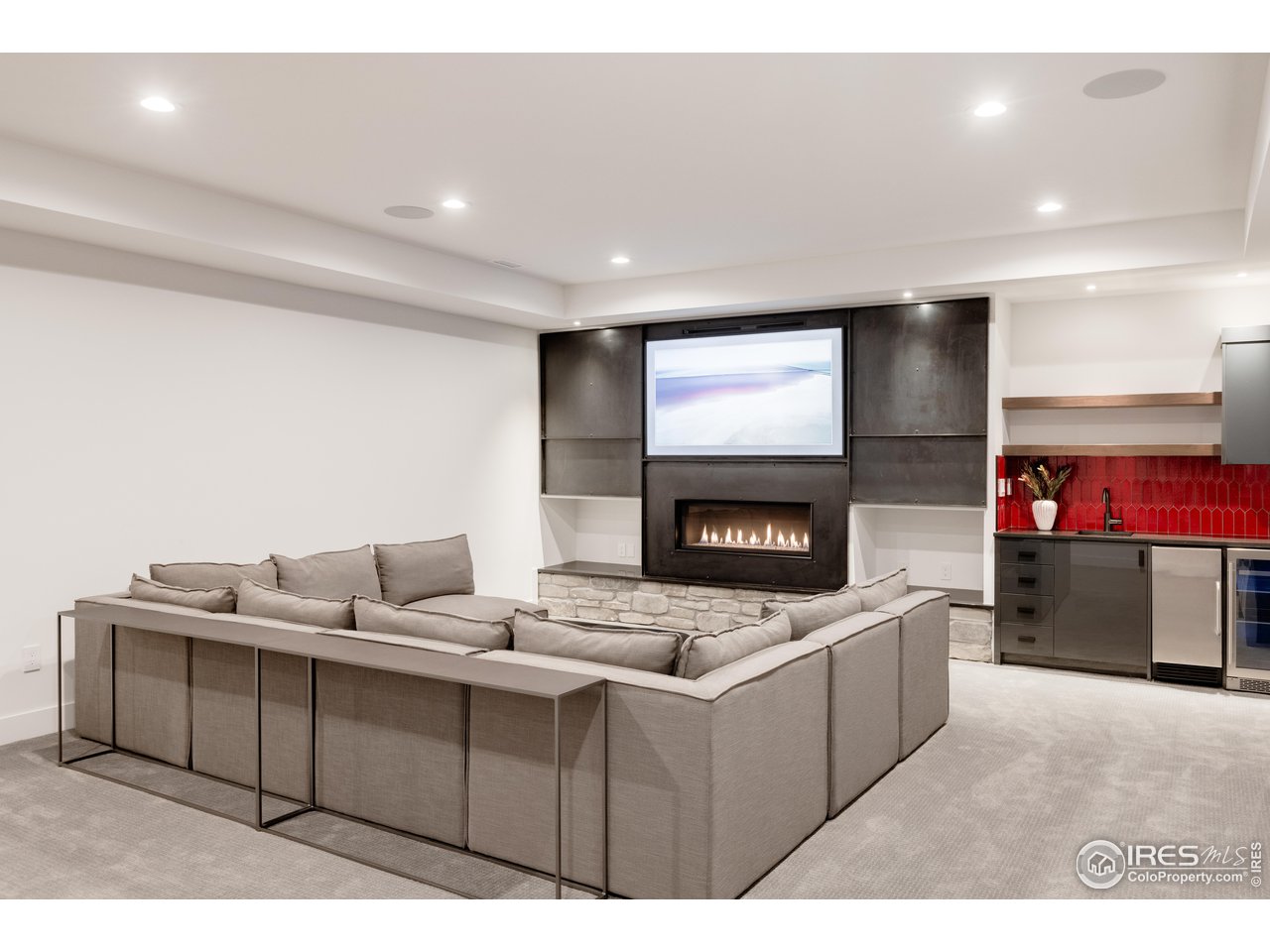 3996 26th Street Boulder, CO 80304 - Photo 32 of 39 Lower Level Family Room / Media Room with fireplace